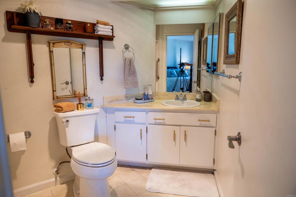 2910 Elm Tree Court Spring Valley, CA 91978 - Photo 18 of 27 a bathroom with a sink vanity mirror and toilet