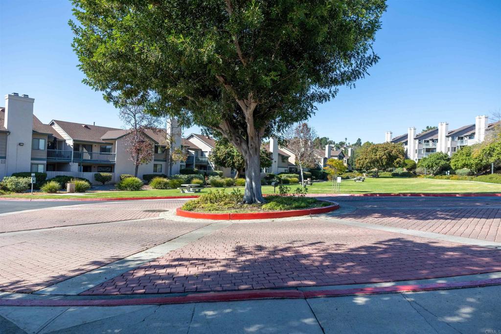 2910 Elm Tree Court Spring Valley, CA 91978 - Photo 22 of 27 a front view of a house with a yard and lake view