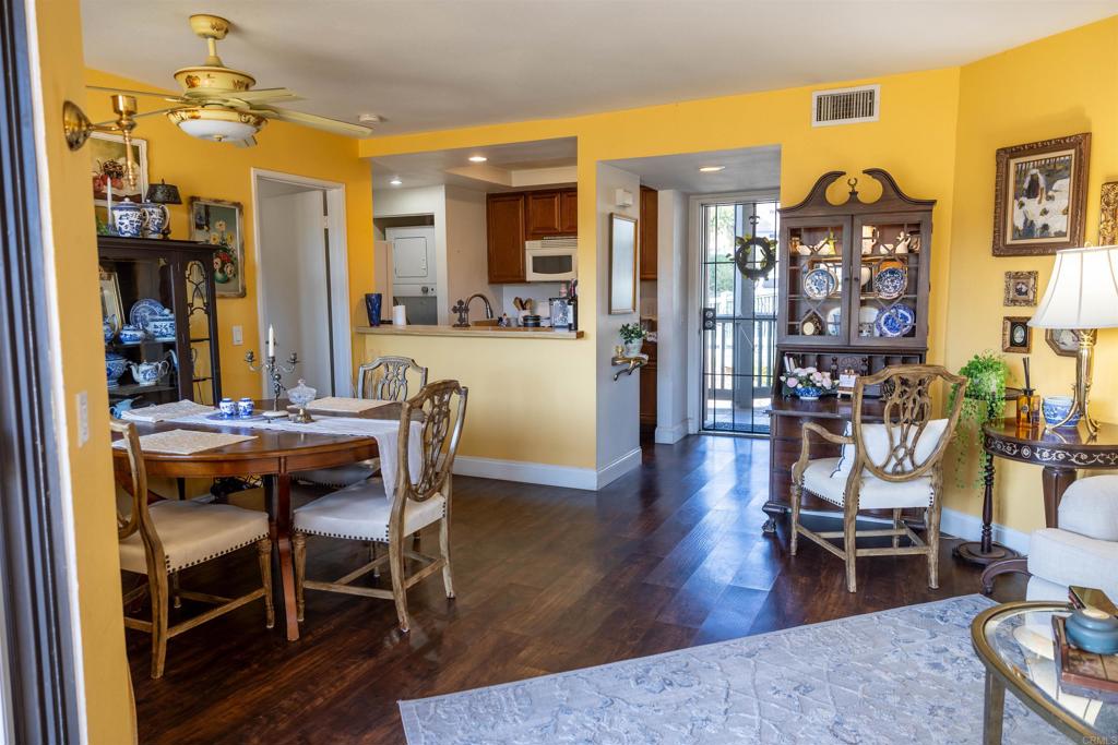 2910 Elm Tree Court Spring Valley, CA 91978 - Photo 6 of 27 a view of a dining room with furniture and wooden floor