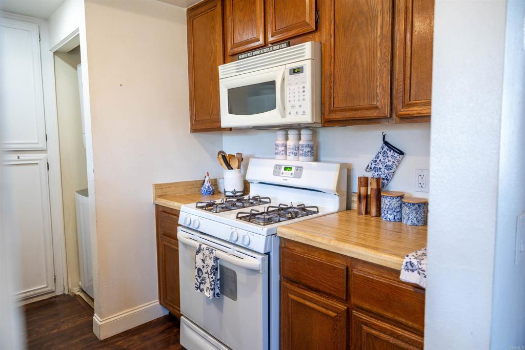 2910 Elm Tree Court Spring Valley, CA 91978 - Photo 8 of 27 a kitchen with stainless steel appliances granite countertop a stove and a microwave