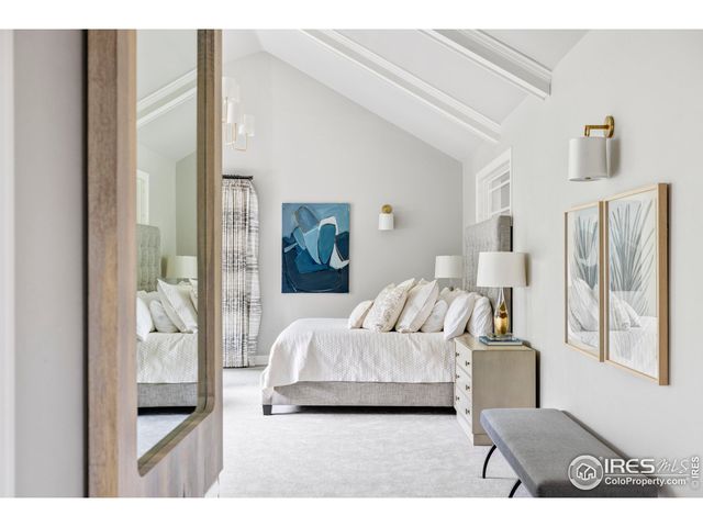 a bedroom with furniture and a window