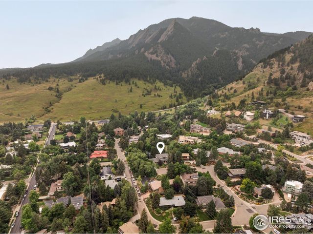 a view of a town with mountains in the background