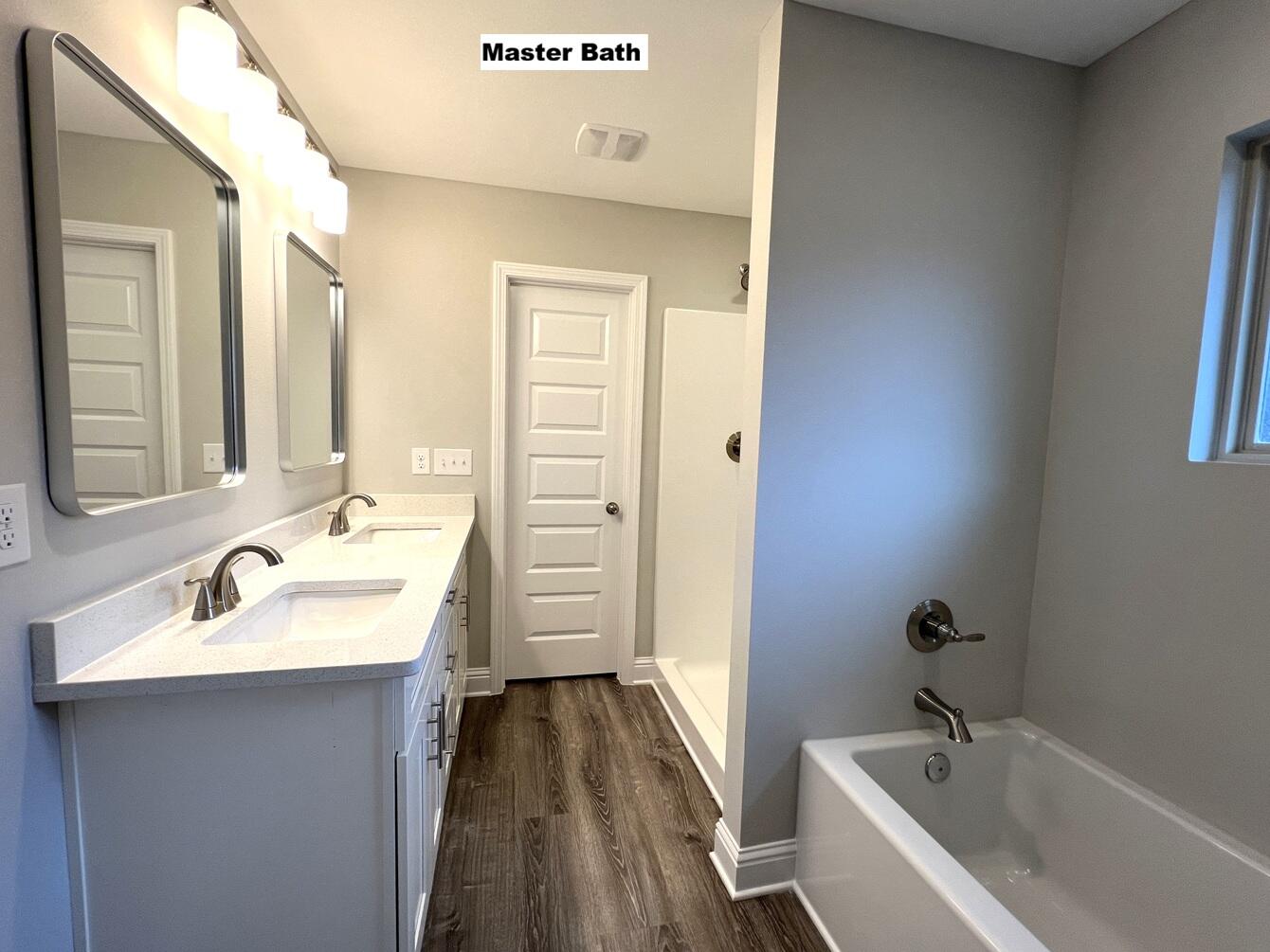 445 Scooter Cove Crestview, FL 32539 - Photo 11 of 22 a bathroom with a sink and a bathtub