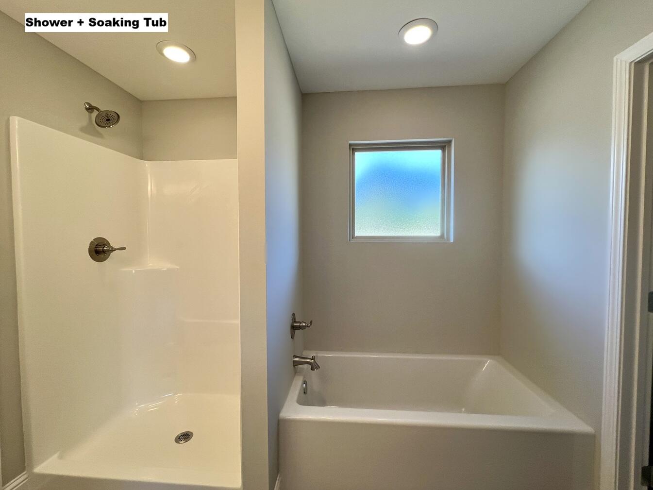 445 Scooter Cove Crestview, FL 32539 - Photo 13 of 22 a bathroom with a bathtub