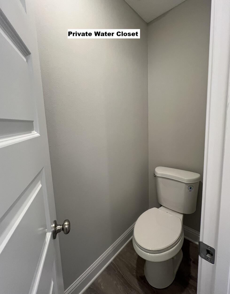 445 Scooter Cove Crestview, FL 32539 - Photo 14 of 22 a white toilet sitting next to a shower