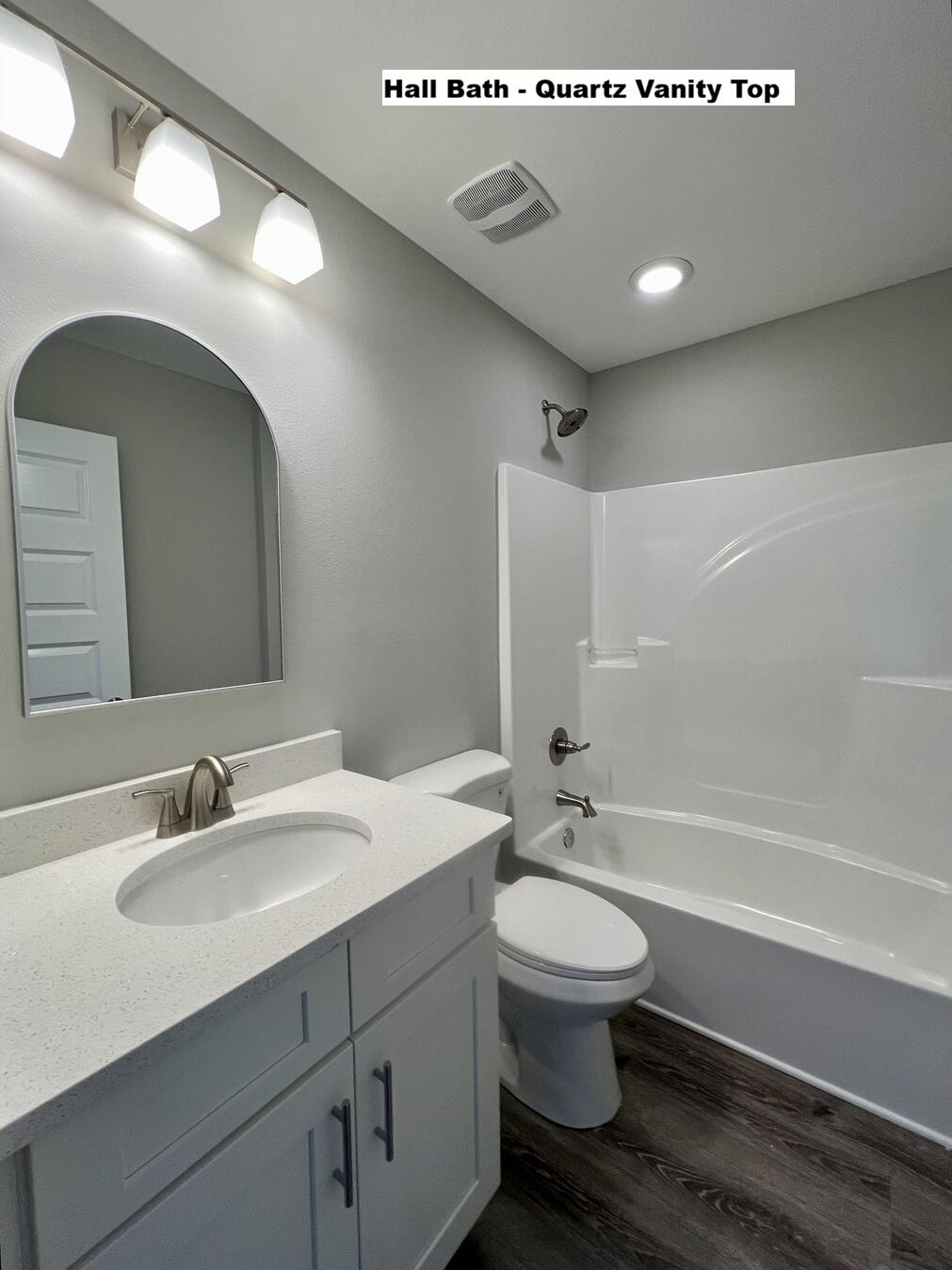 445 Scooter Cove Crestview, FL 32539 - Photo 15 of 22 a bathroom with a sink a toilet and a mirror