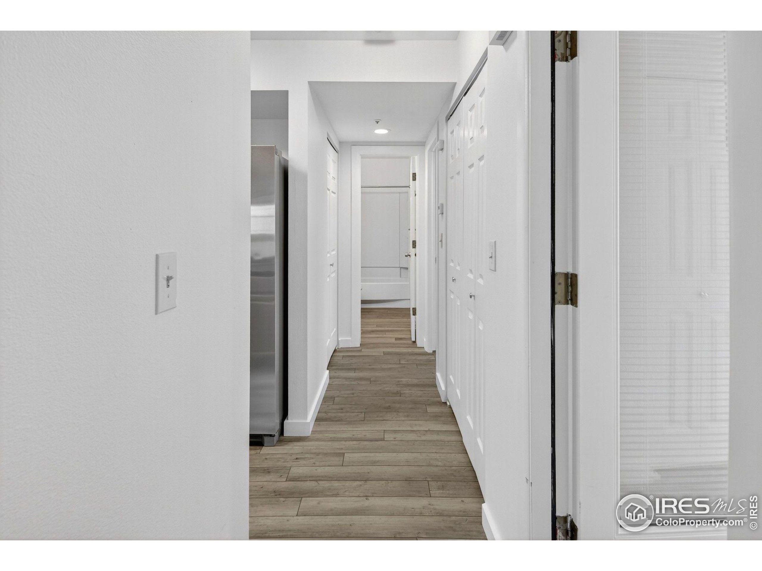 2317 Walnut Street Boulder, CO 80302 - Photo 13 of 34 a view of a hallway with wooden floor