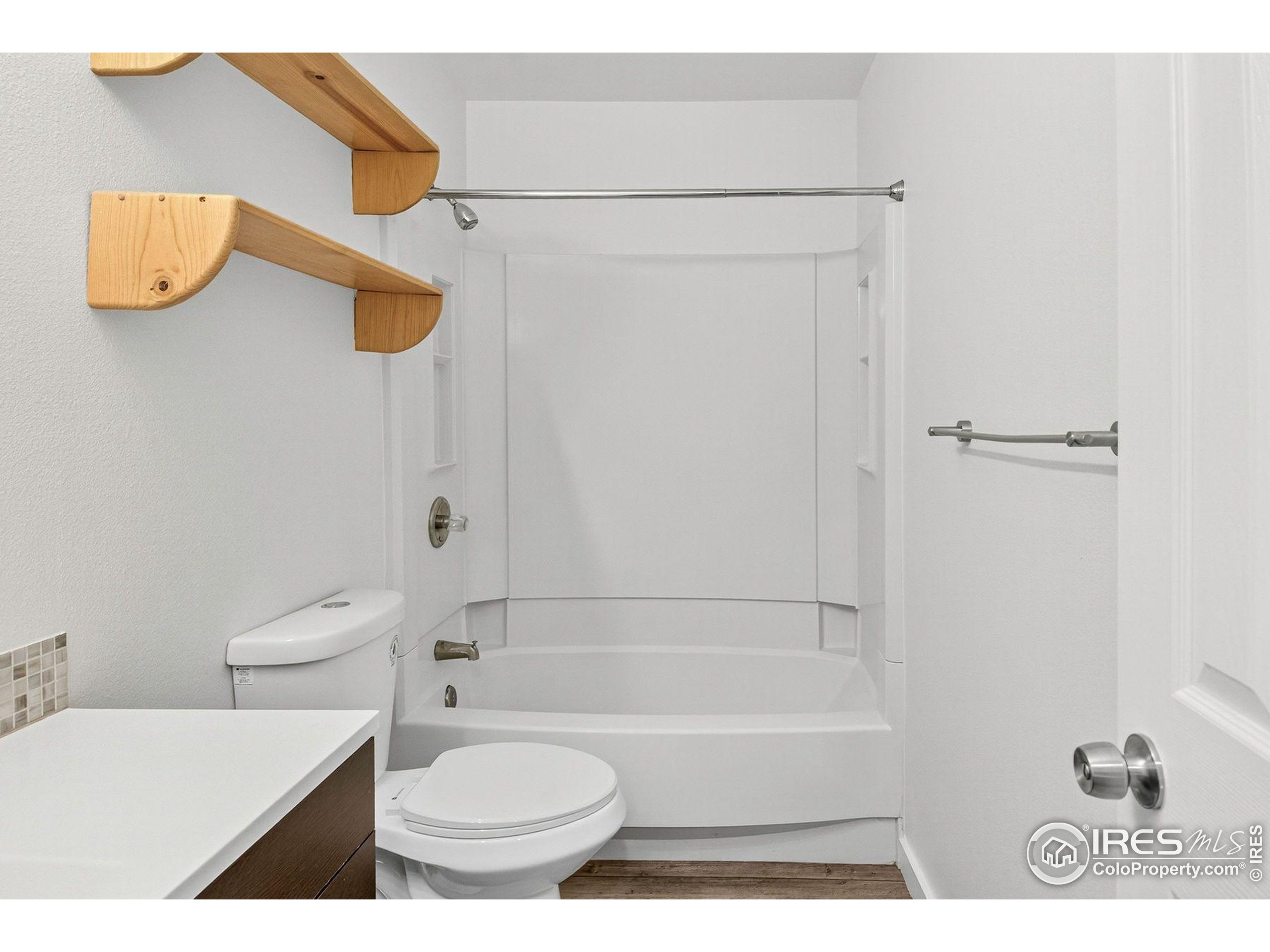 2317 Walnut Street Boulder, CO 80302 - Photo 18 of 34 a bathroom with a toilet and a bath tub
