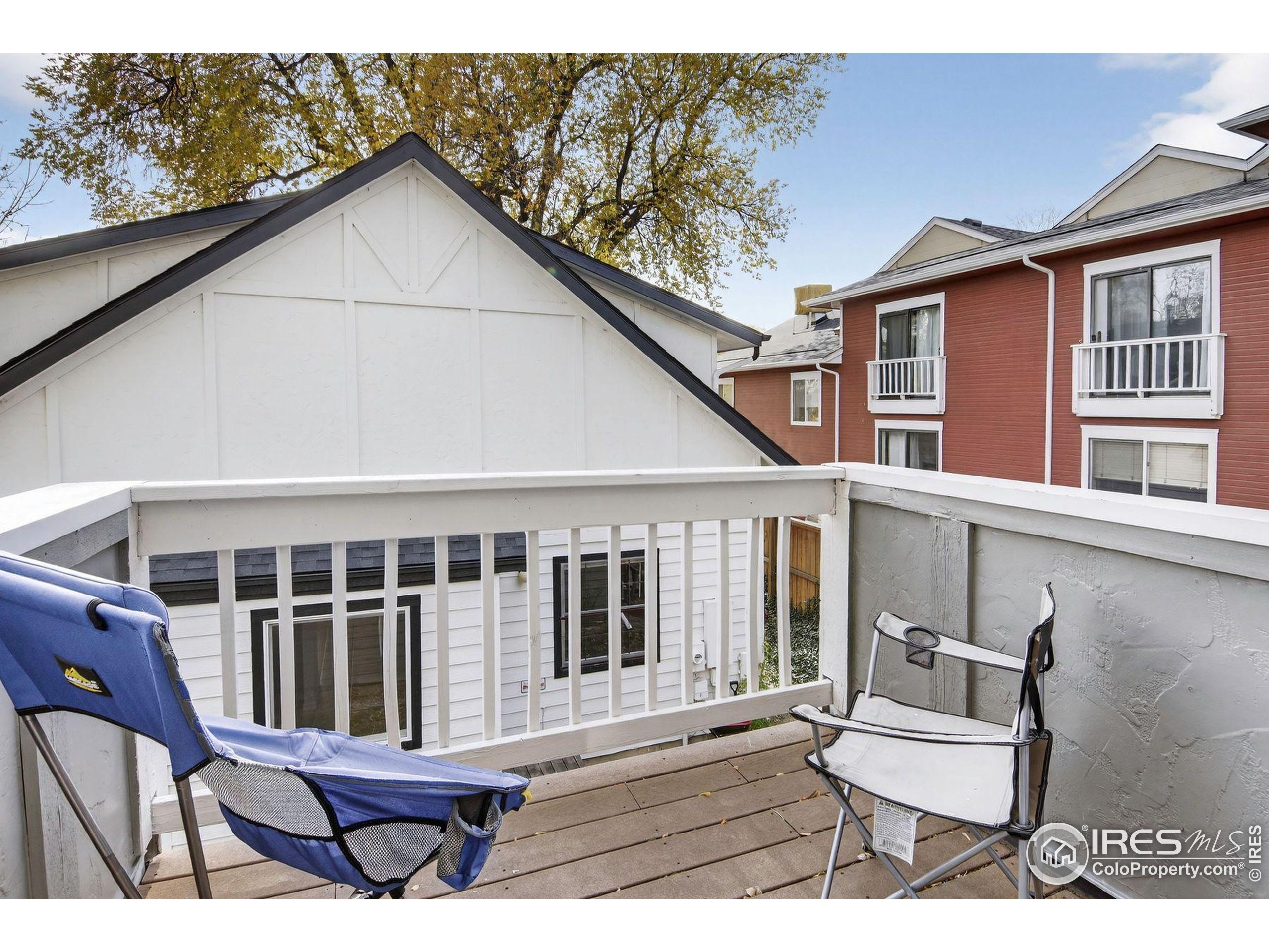 2317 Walnut Street Boulder, CO 80302 - Photo 22 of 34 a view of a wooden chairs and a table in the balcony