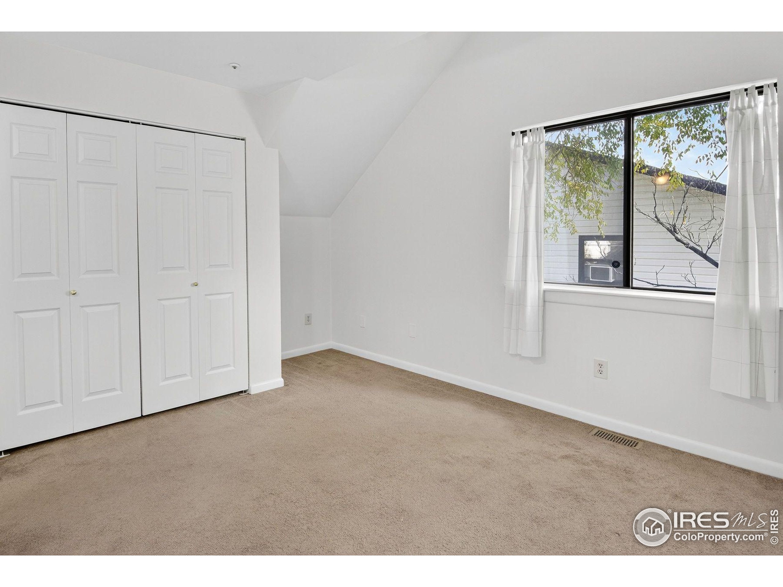 2317 Walnut Street Boulder, CO 80302 - Photo 27 of 34 a view of an empty room with a window