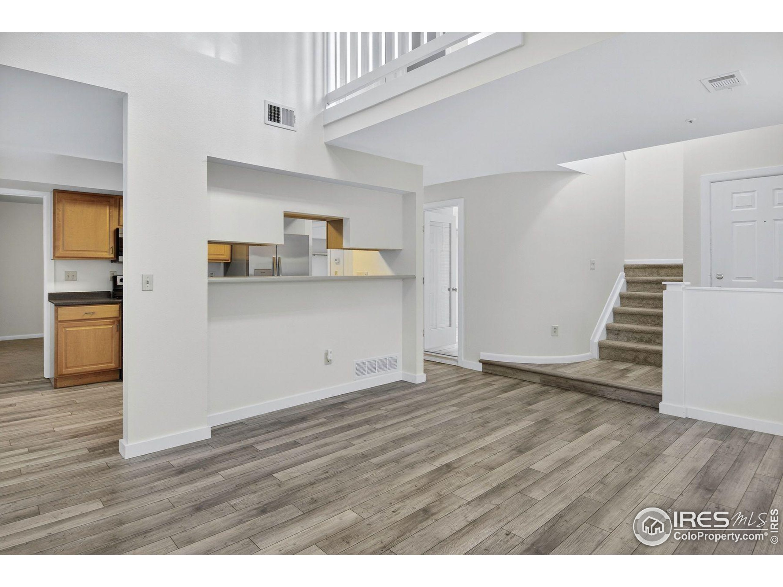 2317 Walnut Street Boulder, CO 80302 - Photo 6 of 34 a view of kitchen with wooden floor and electronic appliances