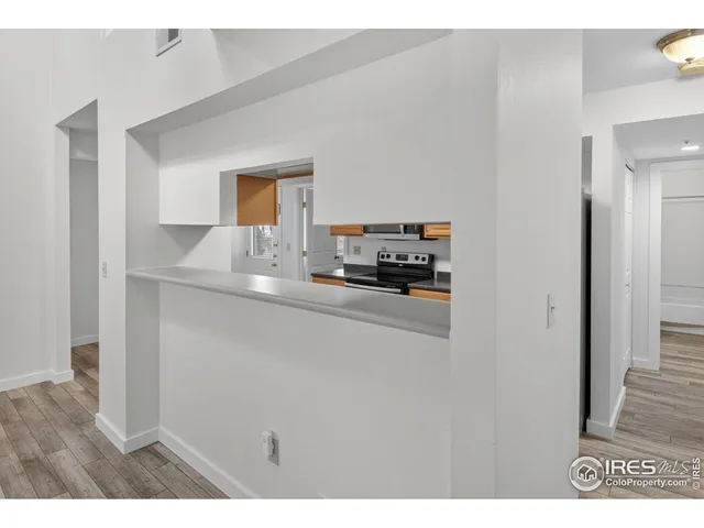 a kitchen with a sink stove and refrigerator