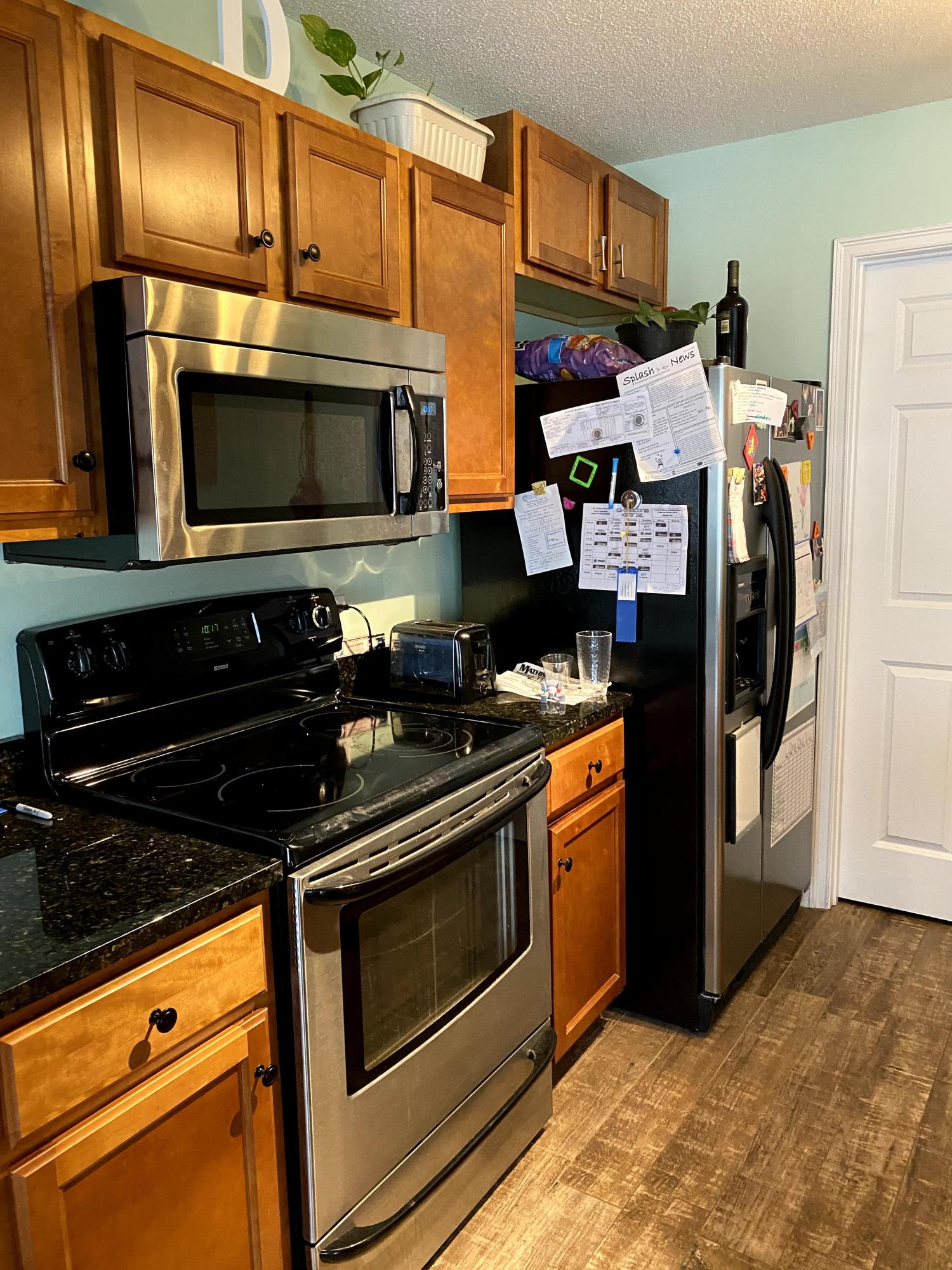 26 3rd Street Shalimar, FL 32579 - Photo 13 of 21 a kitchen with stainless steel appliances granite countertop a stove and a microwave