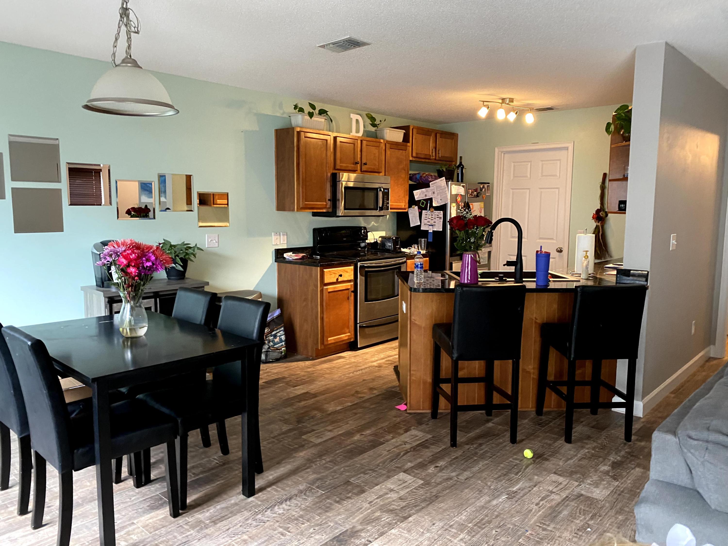 26 3rd Street Shalimar, FL 32579 - Photo 17 of 21 a view of a dining room with furniture and chandelier