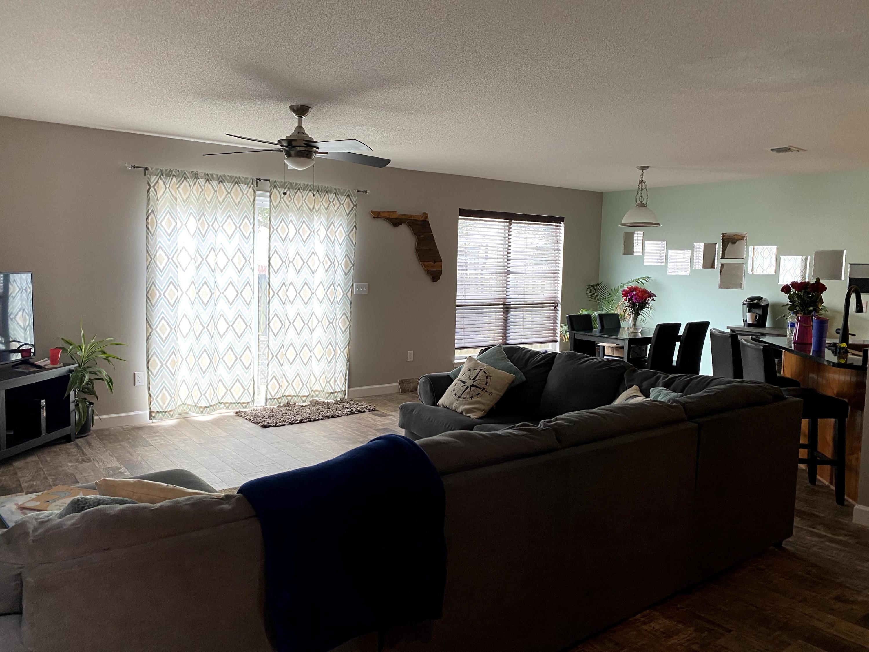 26 3rd Street Shalimar, FL 32579 - Photo 20 of 21 a living room with furniture and a large window