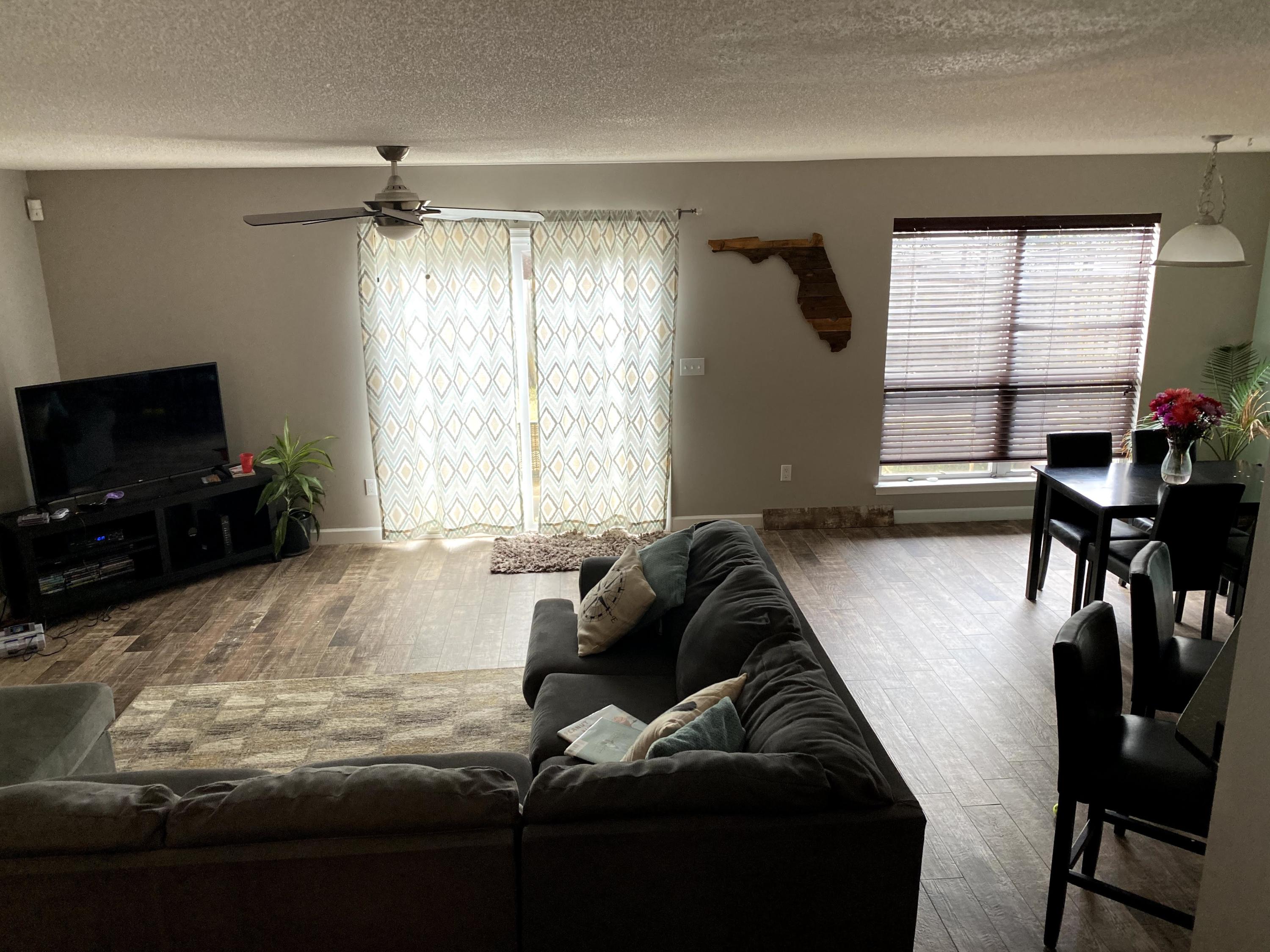 26 3rd Street Shalimar, FL 32579 - Photo 3 of 21 a living room with furniture and a flat screen tv
