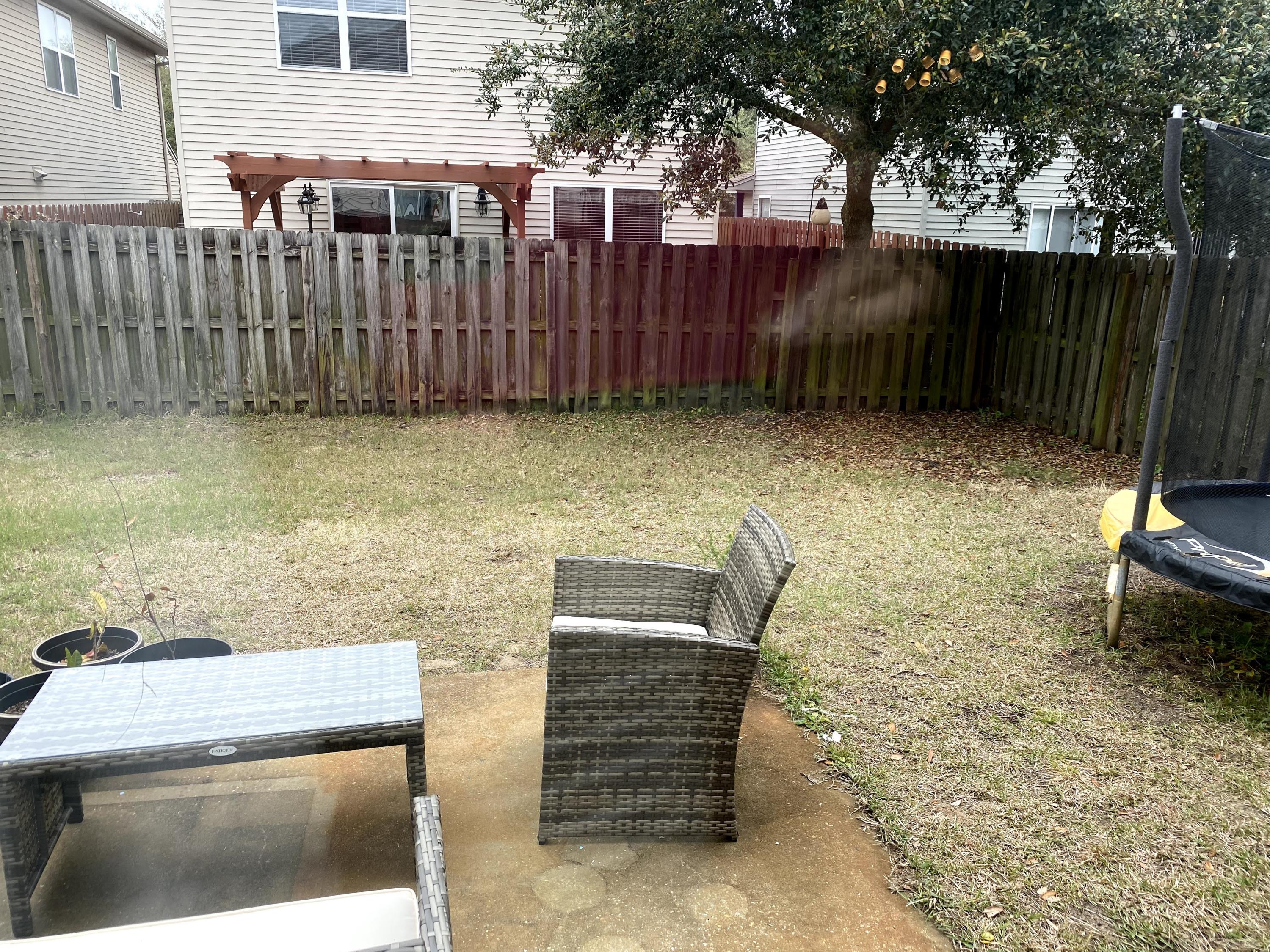 26 3rd Street Shalimar, FL 32579 - Photo 5 of 21 a backyard of a house with barbeque oven