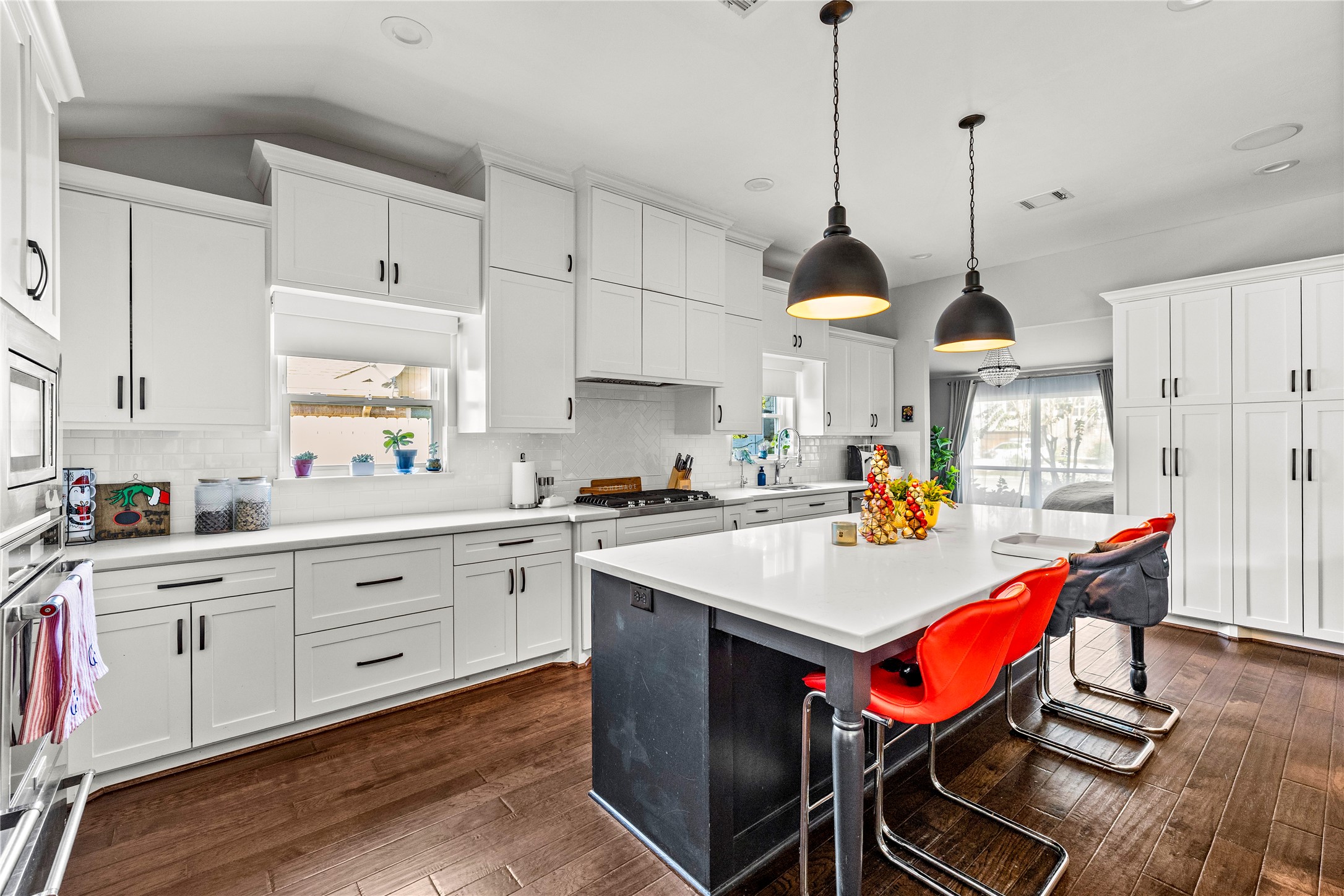 8422 Academy Street Houston, TX 77025 - Photo 11 of 47 Beautiful open kitchen with a huge quartz island perfect for cooking, hosting, and homework time.