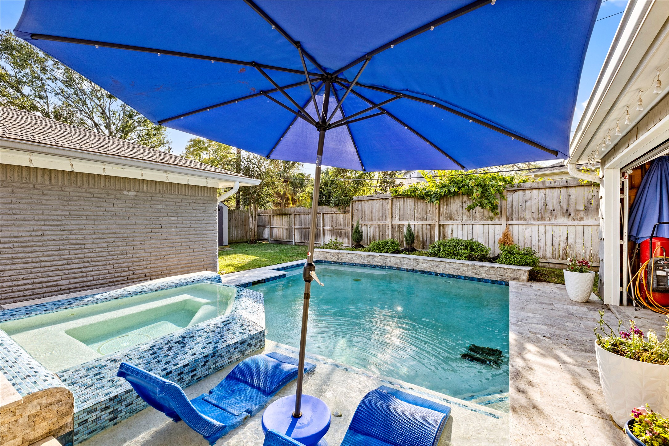 8422 Academy Street Houston, TX 77025 - Photo 2 of 47 a view of yard from deck with patio