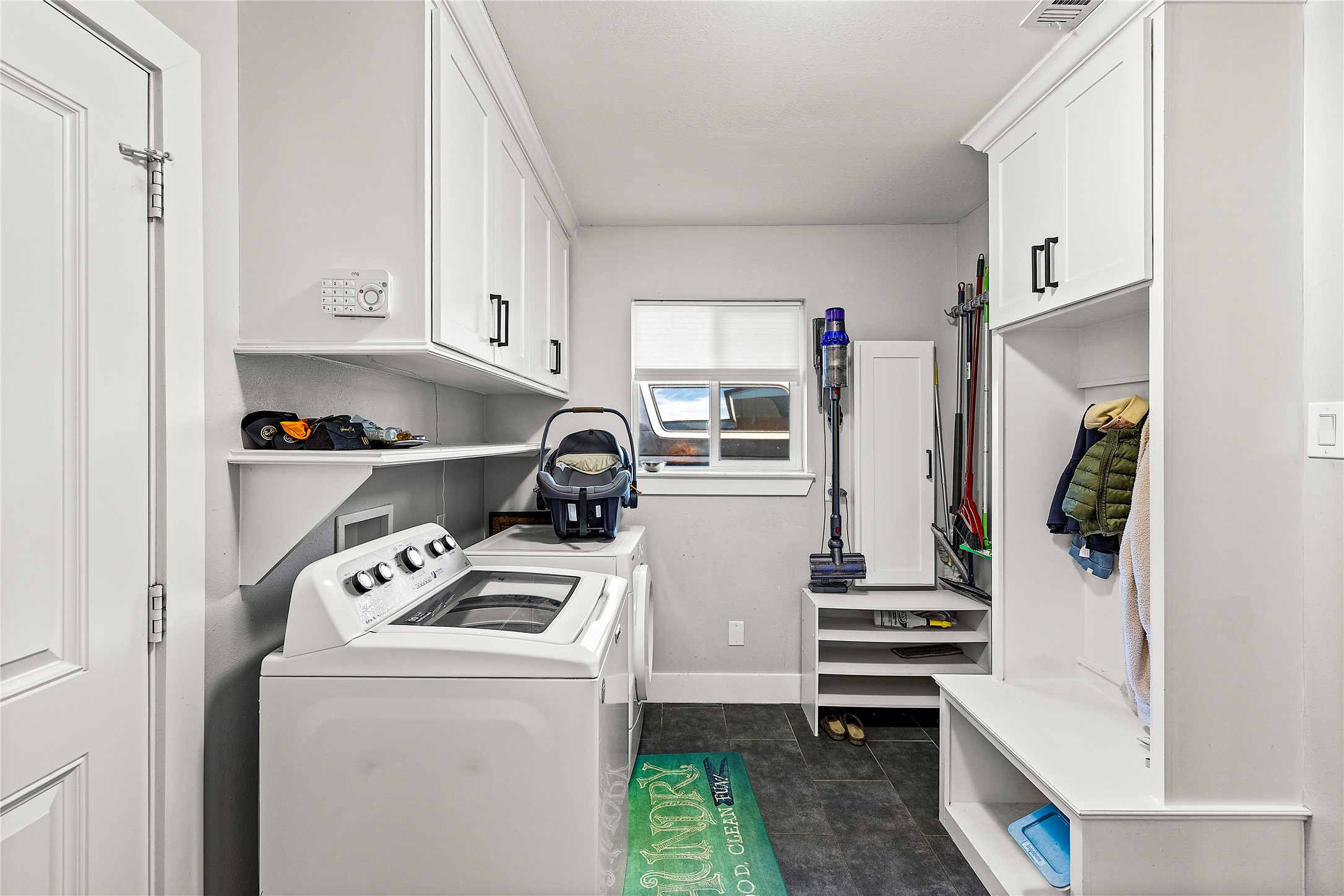 8422 Academy Street Houston, TX 77025 - Photo 31 of 47 A super functional mudroom + laundry combo designed for busy family life. Built-in storage keeps backpacks, jackets, and laundry organized and out of the way.