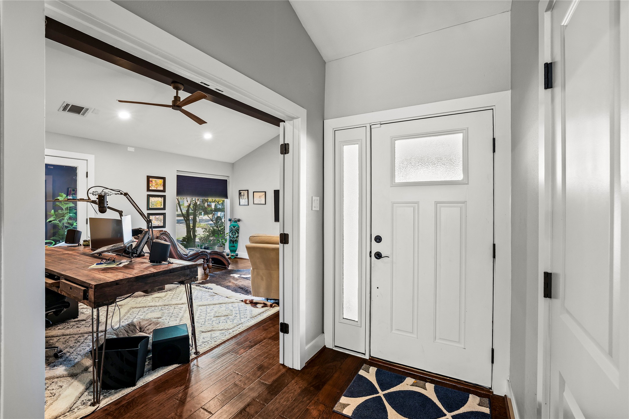 8422 Academy Street Houston, TX 77025 - Photo 37 of 47 Step inside to a bright and inviting foyer with stylish finishes and a warm, modern feel. The entry opens to a spacious flex room ideal for a home office or study featuring rich flooring and abundant natural light.