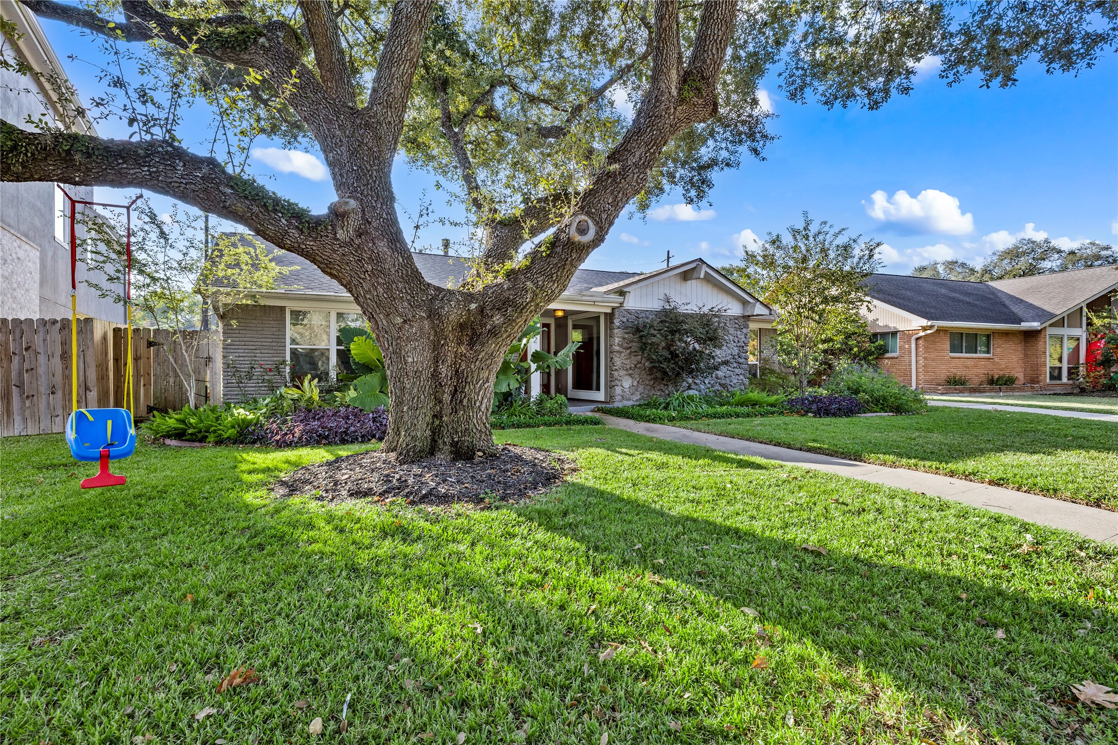 8422 Academy Street Houston, TX 77025 - Photo 44 of 47 a view of a house with backyard and a tree