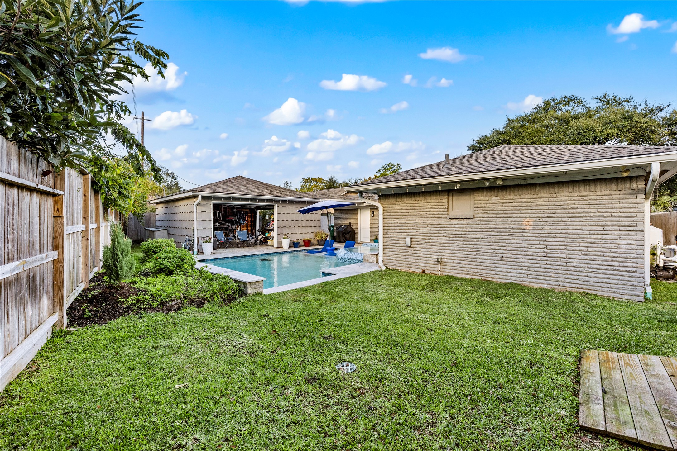 8422 Academy Street Houston, TX 77025 - Photo 45 of 47 a front view of a house with a yard