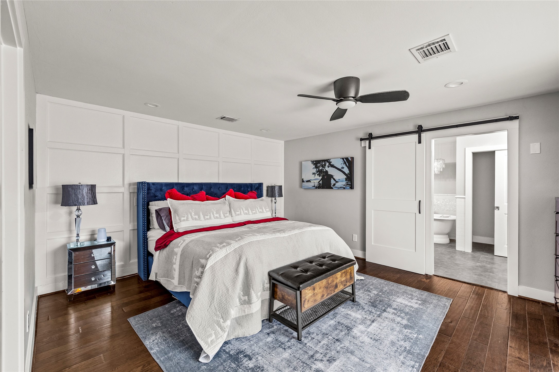 8422 Academy Street Houston, TX 77025 - Photo 8 of 47 a bedroom with a bed and a chandelier