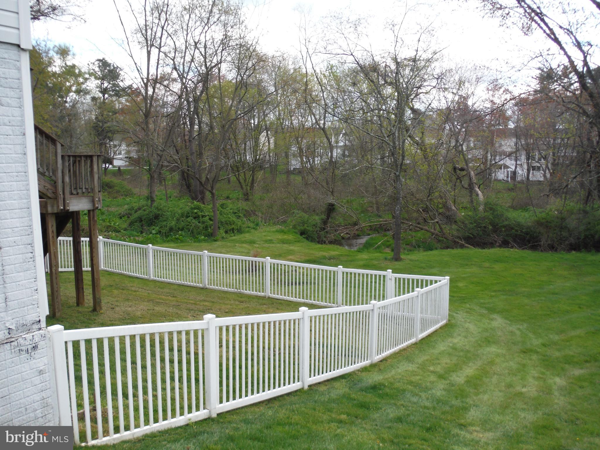 105 Douglass Court Rising Sun, MD 21911 - Photo 5 of 35 Fenced in backyard backed to woods and creek