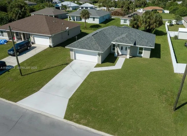 a aerial view of a house with a yard