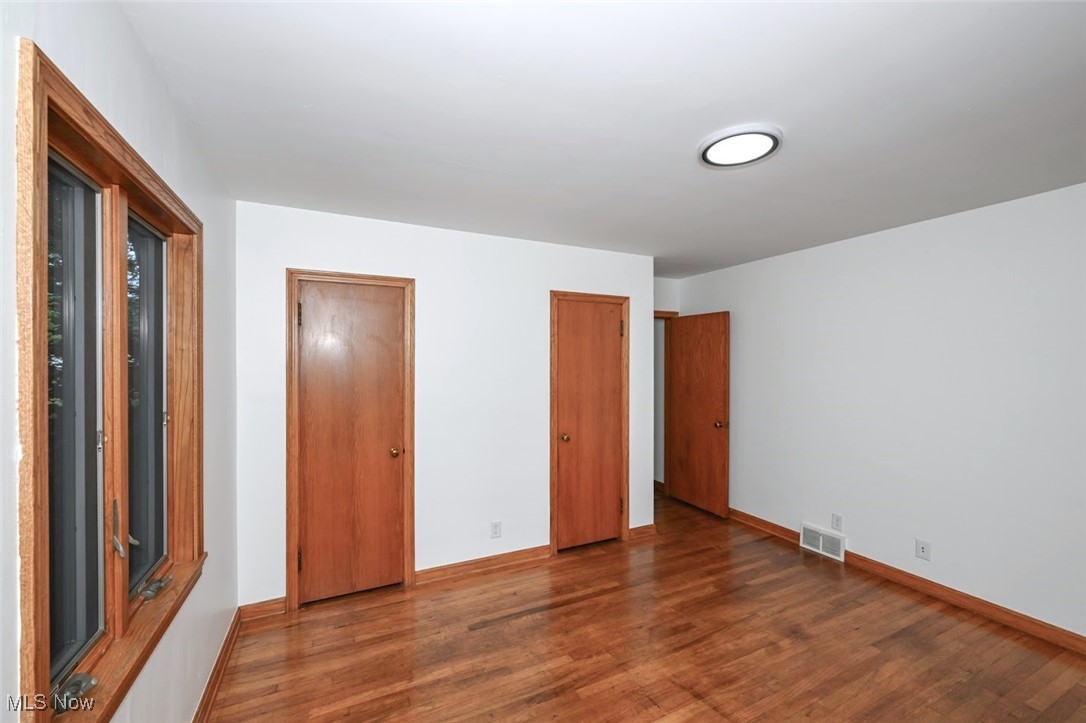 351 North Messner Road Akron, OH 44319 - Photo 25 of 44 *BDRM #2 WITH DOUBLE CLOSET DOORS 8'8" WIDE CLOSET, LED LIGHTING AND NATURAL HARDWOOD FLOORS ~