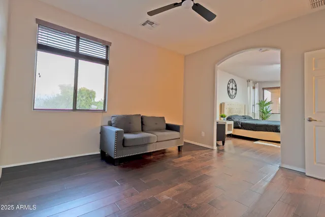 a living room with furniture and a window