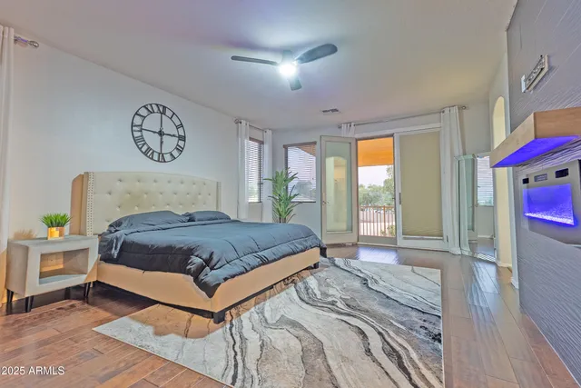 a bedroom with a bed and a window