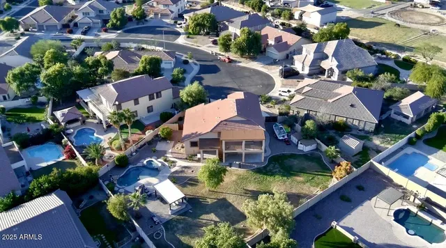 an aerial view of multiple houses with yard