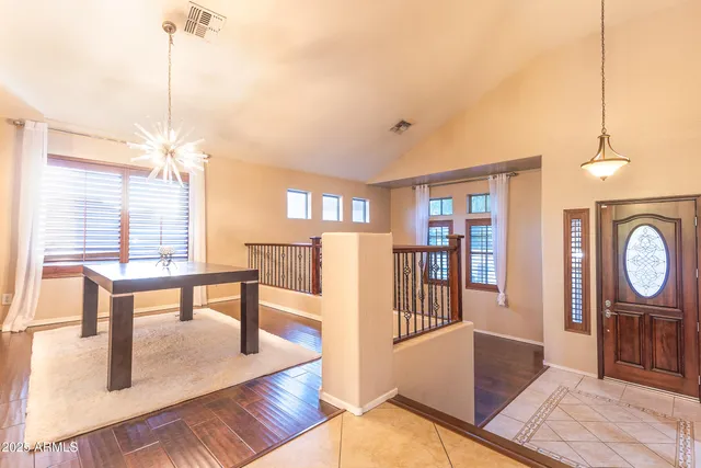 a living room with furniture a rug and a window