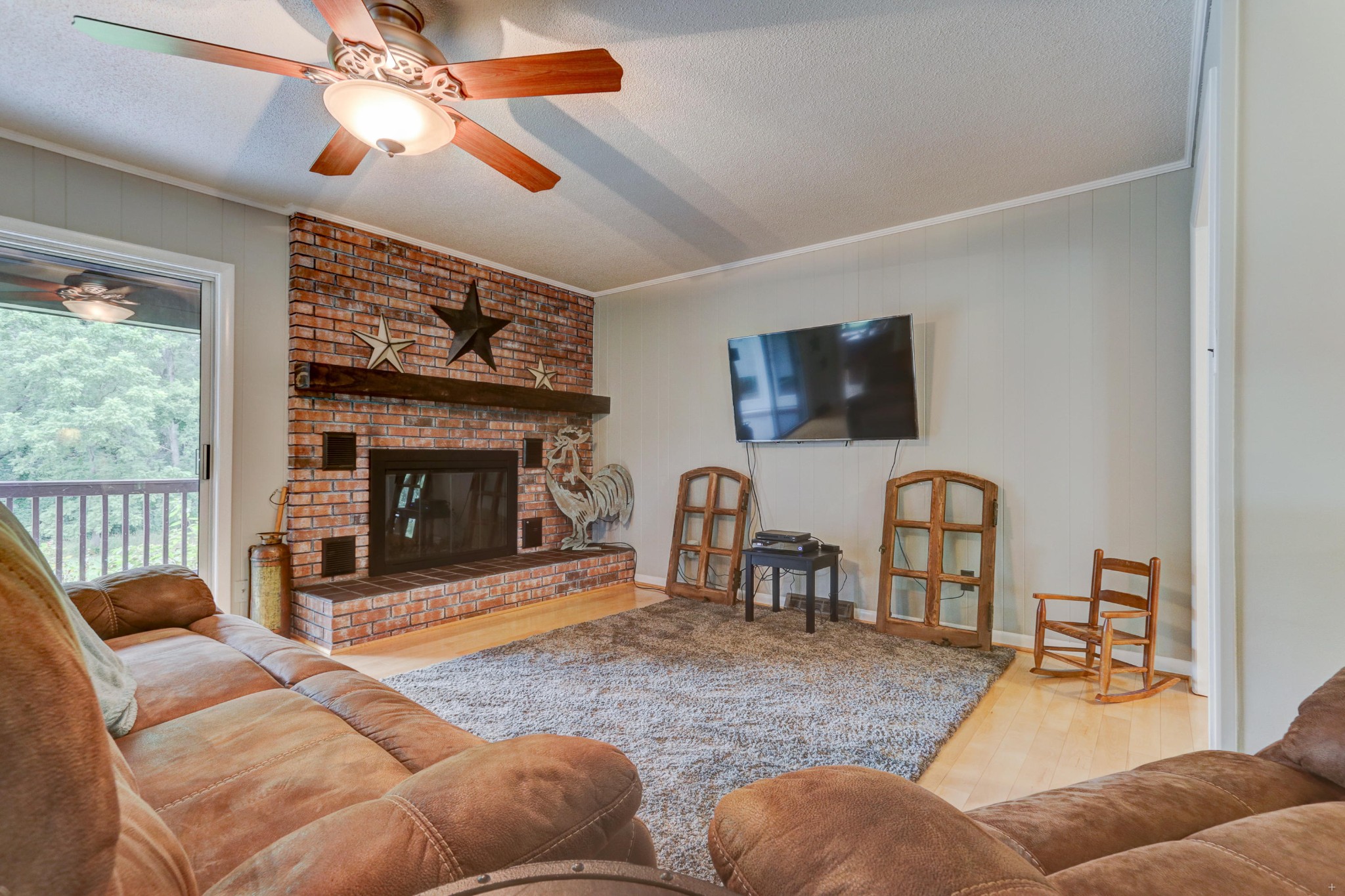 8520 Majors Road Corryton, TN 37721 - Photo 4 of 28 a living room with furniture a fireplace and a flat screen tv