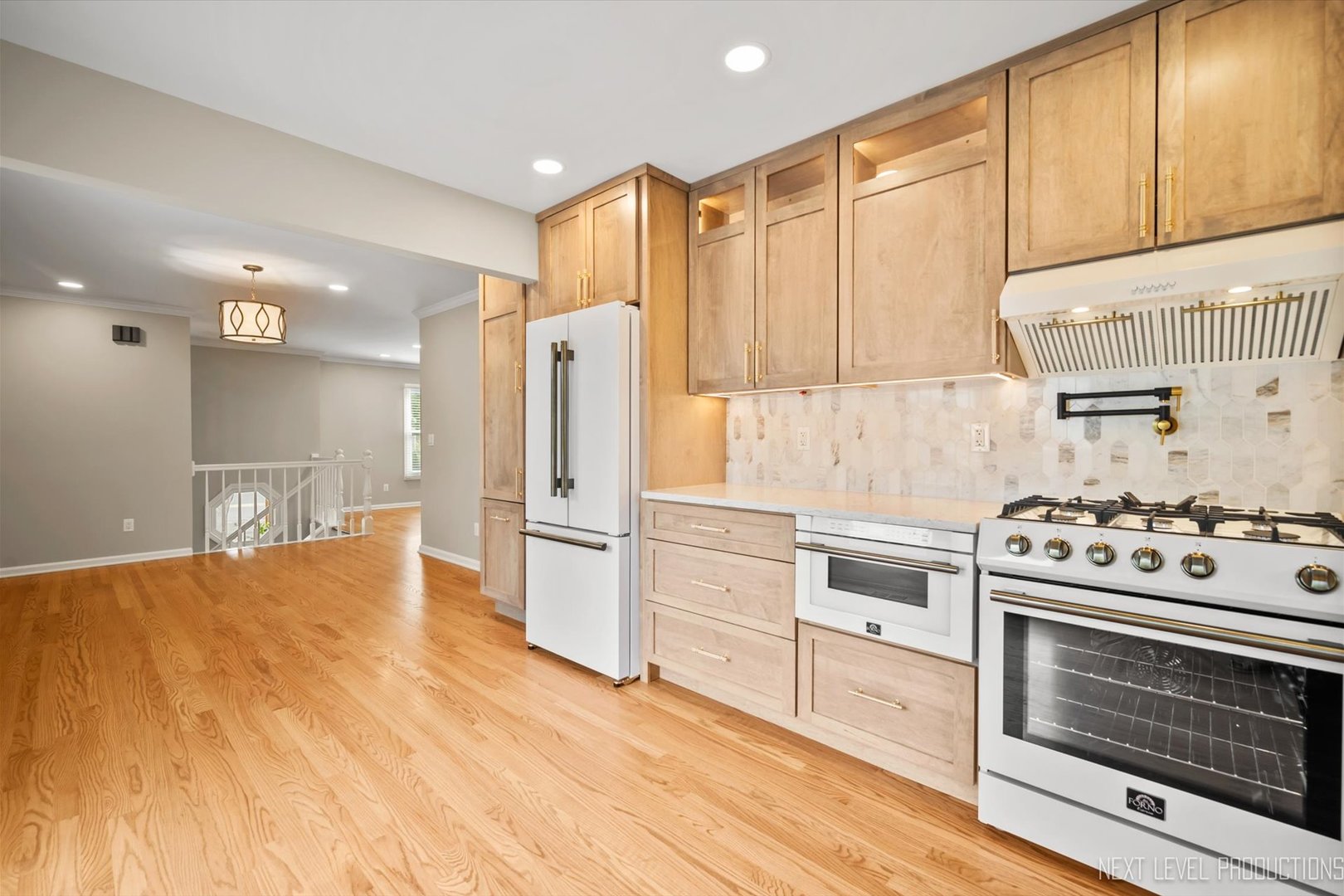 1718 Jeanette Avenue St. Charles, IL 60174 - Photo 15 of 36 a kitchen with stainless steel appliances a stove a refrigerator and cabinets