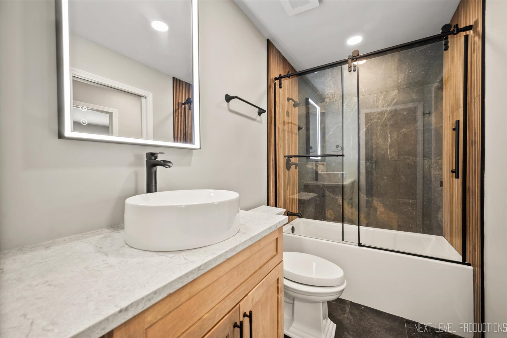1718 Jeanette Avenue St. Charles, IL 60174 - Photo 20 of 36 a bathroom with a sink toilet and shower