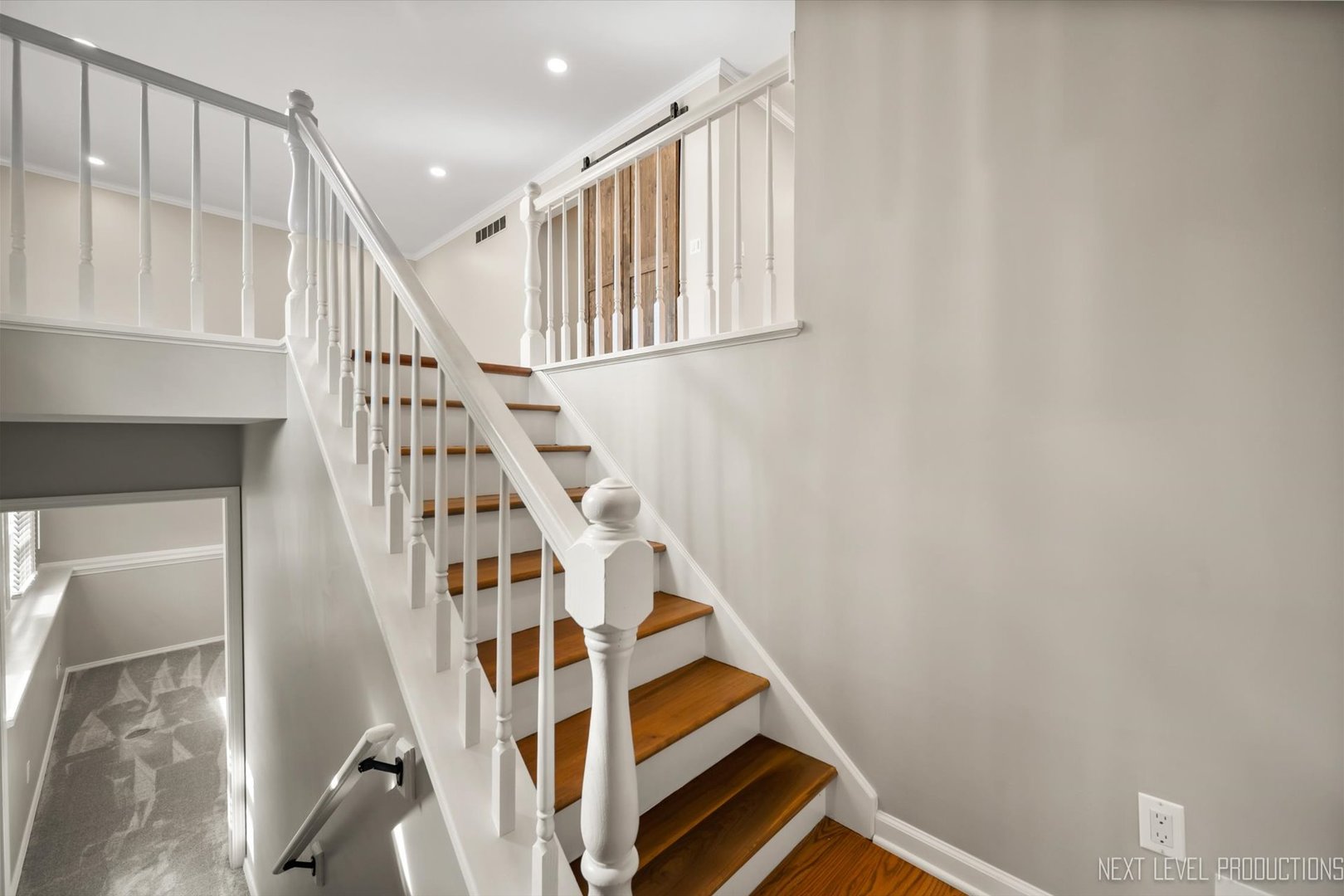 1718 Jeanette Avenue St. Charles, IL 60174 - Photo 6 of 36 a view of staircase with wooden floor and white walls