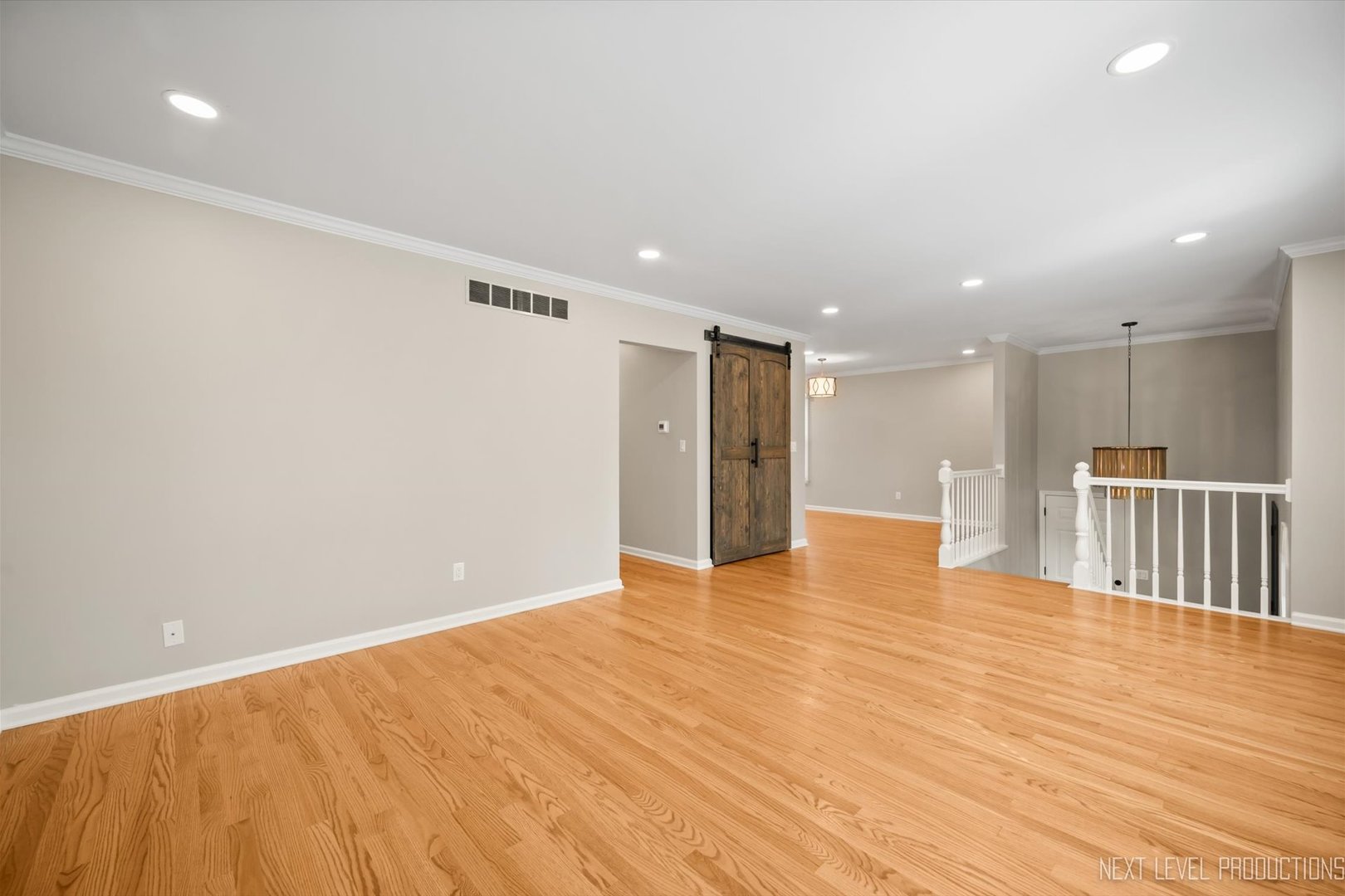 1718 Jeanette Avenue St. Charles, IL 60174 - Photo 10 of 36 a view of an empty room with wooden floor