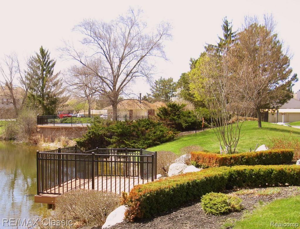 22246 Edgewater, Unit 148 Novi, MI 48375 - Photo 15 of 16 POOL OVERLOOKING POND.jpg