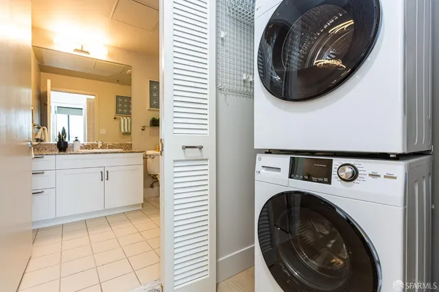 a living room with furniture and potted plant