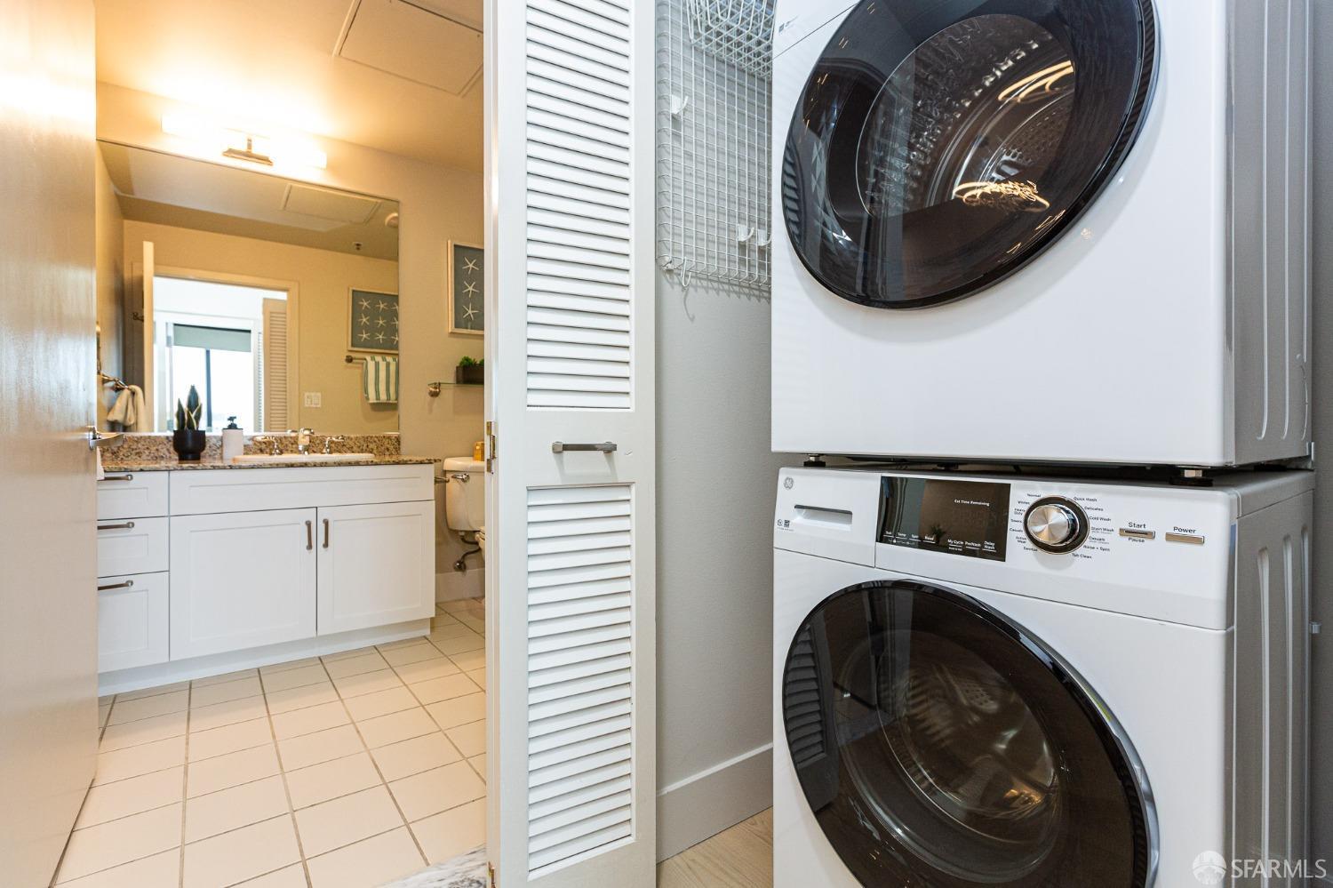 260 King Street, Unit 1107 San Francisco, CA 94107 - Photo 19 of 58 a view of a hallway with washer and dryer