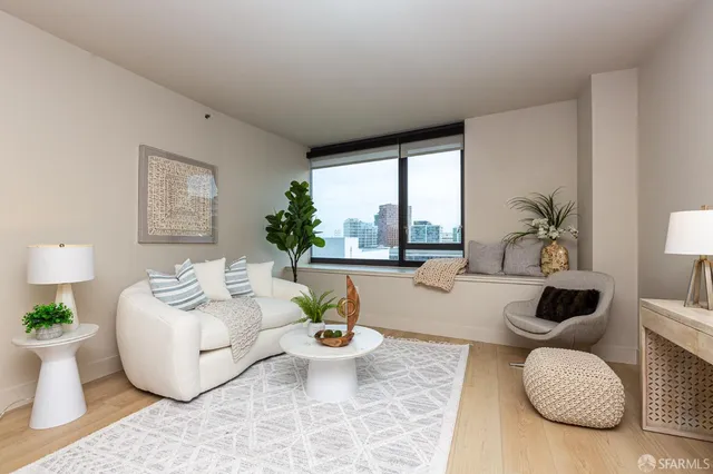 a living room with furniture and a mirror