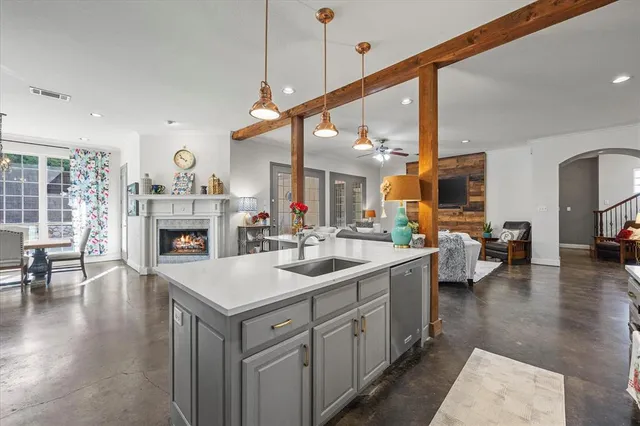 a kitchen with sink and cabinets