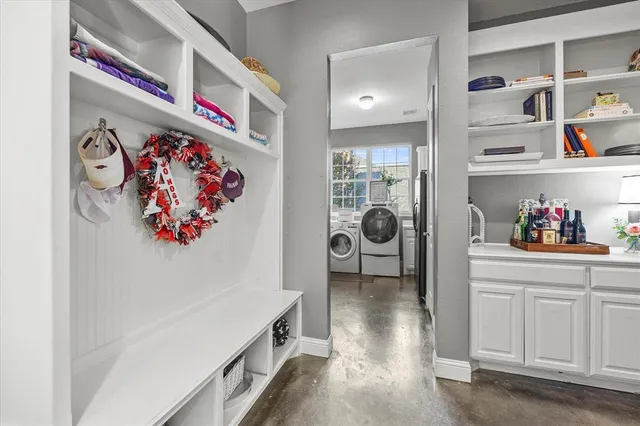 a view of a hallway with shelf and cabinet