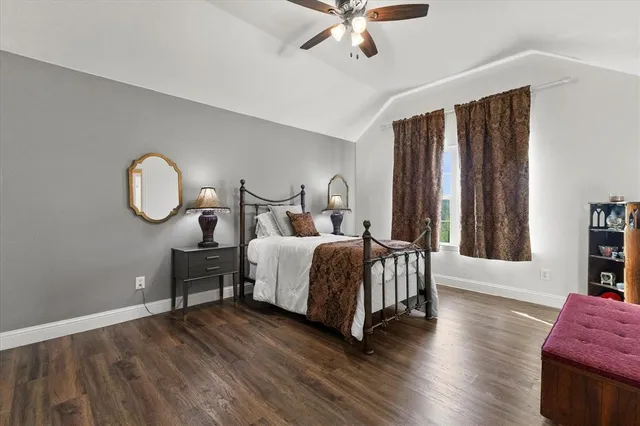 a bedroom with a bed furniture and a window