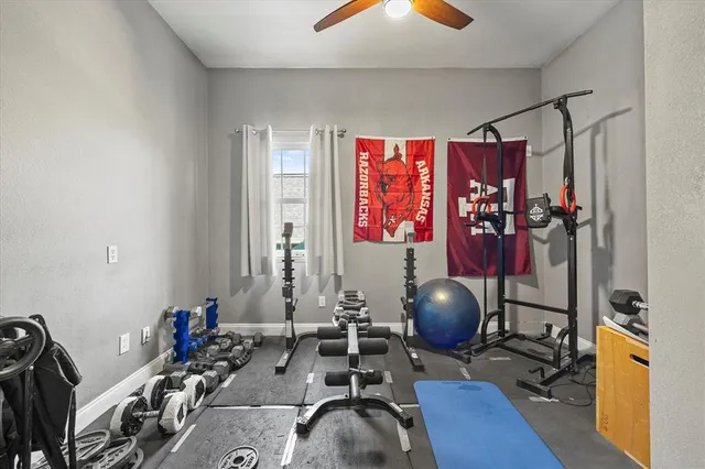 a bathroom with a toilet sink vanity and mirror