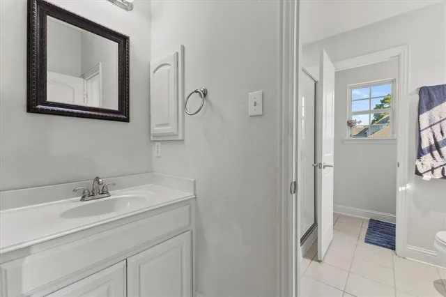 a room with a bed and a chandelier