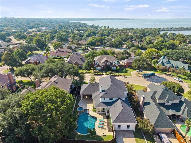 an aerial view of a house with outdoor space